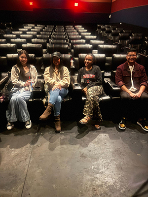 four student inside theater