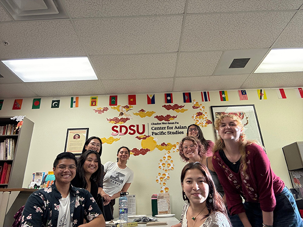 students and faculty at party