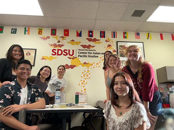 students and faculty at party