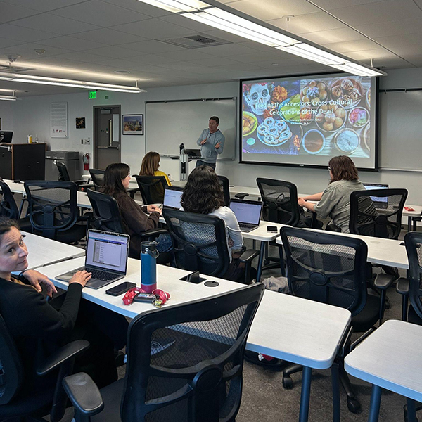 man giving lecture in classroom