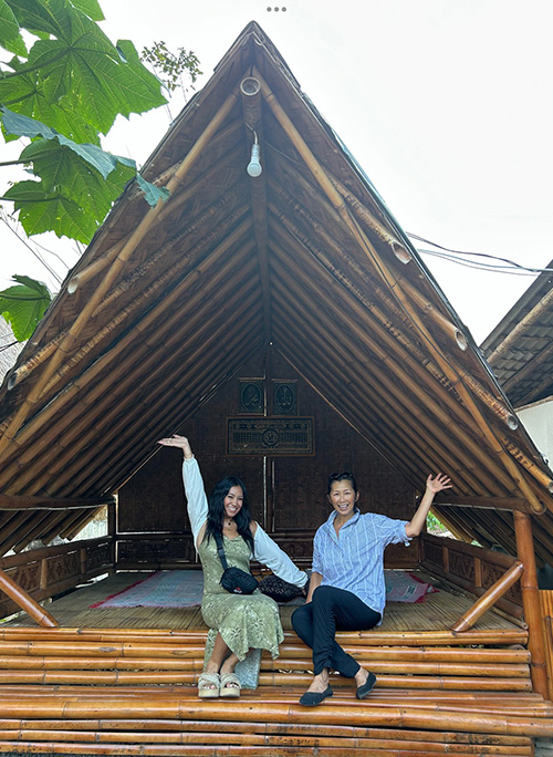 two woman in a wood hut in Indonesia